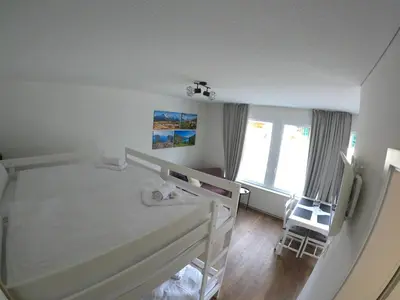 Ein Bett oder Betten in einem Zimmer der Unterkunft Red Nest