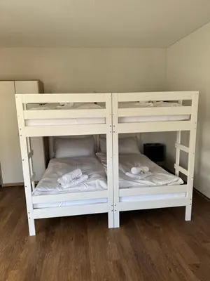 Ein Bett oder Betten in einem Zimmer der Unterkunft Red Nest