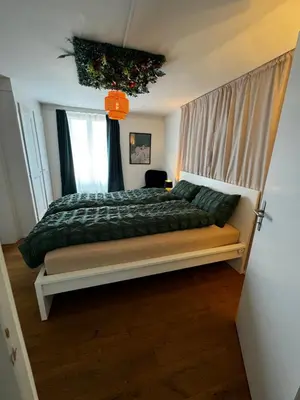 Ein Bett oder Betten in einem Zimmer der Unterkunft Cozy City Nest