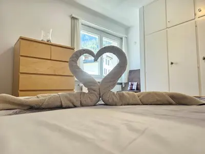 Ein Bett oder Betten in einem Zimmer der Unterkunft Leukerfun