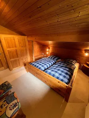 Ein Bett oder Betten in einem Zimmer der Unterkunft Chalet Karin