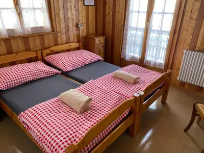 Ein Bett oder Betten in einem Zimmer der Unterkunft Séjour Edelweiss