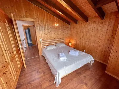 Ein Bett oder Betten in einem Zimmer der Unterkunft Chalet l'Aiglon Valais - Vue, Confort, Jacuzzi