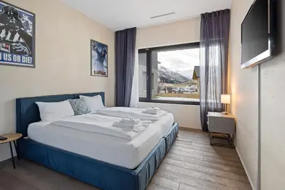 Ein Bett oder Betten in einem Zimmer der Unterkunft Alpen Apartment I Andermatt I Ski I Parkplatz I Familien