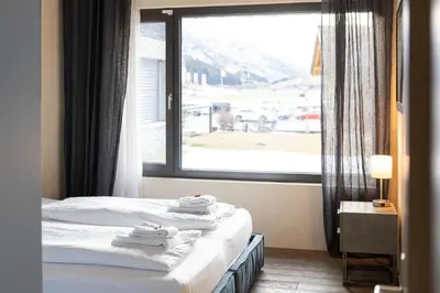Ein Bett oder Betten in einem Zimmer der Unterkunft Alpen Apartment I Andermatt I Ski I Parkplatz I Familien
