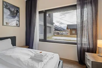 Ein Bett oder Betten in einem Zimmer der Unterkunft Alpen Apartment I Andermatt I Ski I Parkplatz I Familien