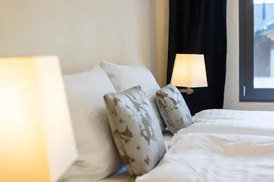 Ein Bett oder Betten in einem Zimmer der Unterkunft Alpen Apartment I Andermatt I Ski I Parkplatz I Familien