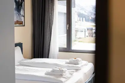 Ein Bett oder Betten in einem Zimmer der Unterkunft Alpen Apartment I Andermatt I Ski I Parkplatz I Familien