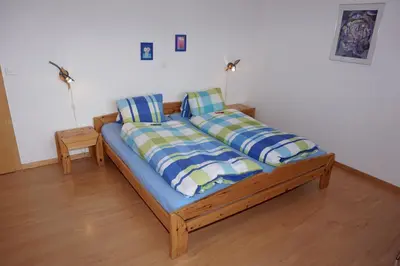 Ein Bett oder Betten in einem Zimmer der Unterkunft Haus Alpsägu, Bettmeralp