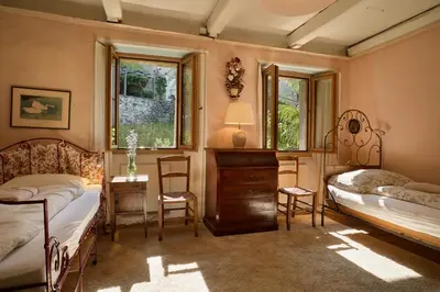 Ein Bett oder Betten in einem Zimmer der Unterkunft Wild Valley Secret Villa in Valle Onsernone