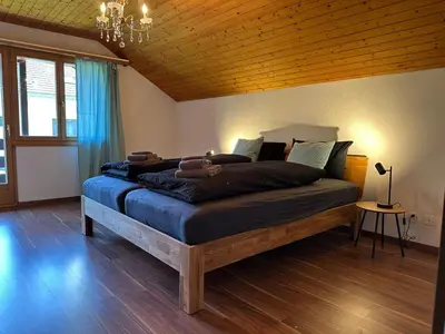 Ein Bett oder Betten in einem Zimmer der Unterkunft Chalet Rose - Einfamilienhaus