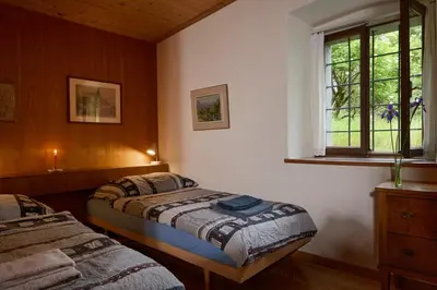 Ein Bett oder Betten in einem Zimmer der Unterkunft Wild Valley Refugium in Valle Onsernone