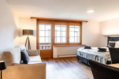Ein Bett oder Betten in einem Zimmer der Unterkunft Studio Nova, Zermatt