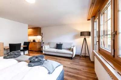 Ein Bett oder Betten in einem Zimmer der Unterkunft Studio Nova, Zermatt
