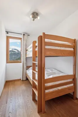Ein Bett oder Betten in einem Zimmer der Unterkunft Chalet White Peak by Miggins