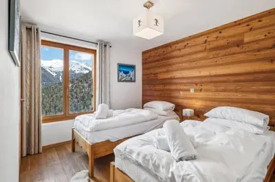 Ein Bett oder Betten in einem Zimmer der Unterkunft Chalet White Peak by Miggins