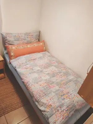 Ein Bett oder Betten in einem Zimmer der Unterkunft Pfeiren Leukerbad