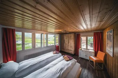 Ein Bett oder Betten in einem Zimmer der Unterkunft EIGERMAGIC Chalet Wartstein