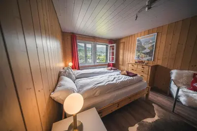 Ein Bett oder Betten in einem Zimmer der Unterkunft EIGERMAGIC Chalet Wartstein