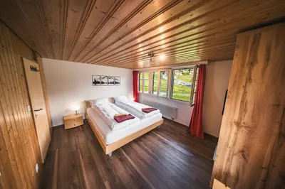 Ein Bett oder Betten in einem Zimmer der Unterkunft EIGERMAGIC Chalet Wartstein