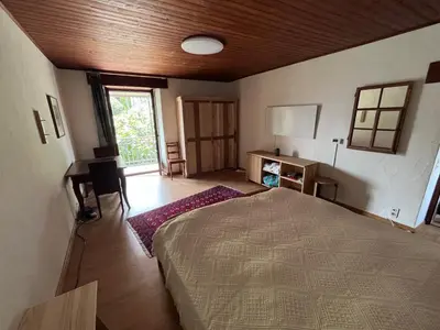 Ein Bett oder Betten in einem Zimmer der Unterkunft Schönes Rustico in bester Lage - 2 min an den See