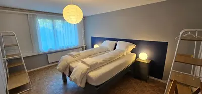 Ein Bett oder Betten in einem Zimmer der Unterkunft Garden Suite Thun