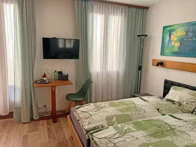 Ein Bett oder Betten in einem Zimmer der Unterkunft Hotel Bellevue