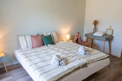 Ein Bett oder Betten in einem Zimmer der Unterkunft BnB Feuille de Vigne