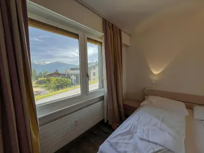 Ein Bett oder Betten in einem Zimmer der Unterkunft Cosy apartment in Crans-Montana