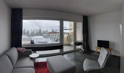 Ein Sitzbereich in der Unterkunft Cosy apartment in Crans-Montana