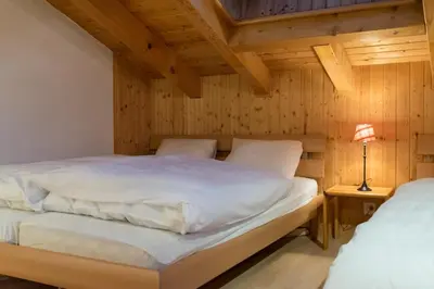 Ein Bett oder Betten in einem Zimmer der Unterkunft Sunny and spacious apartment in chalet Faigaux in Veysonnaz situated in quiet area with magnificent mountain views