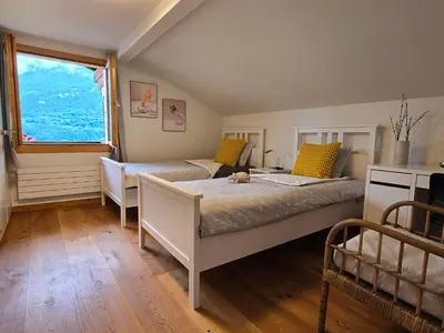 Ein Bett oder Betten in einem Zimmer der Unterkunft Chalet Swiss Alps