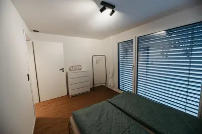 Ein Bett oder Betten in einem Zimmer der Unterkunft Abendrot- grosse moderne und stilvolle Ferienwohnung im Bergdorf Sörenberg