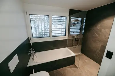 Ein Badezimmer in der Unterkunft Abendrot- grosse moderne und stilvolle Ferienwohnung im Bergdorf Sörenberg