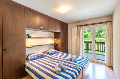 Ein Bett oder Betten in einem Zimmer der Unterkunft Arnica 15 - 4 pers - piscine