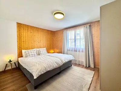 Ein Bett oder Betten in einem Zimmer der Unterkunft Chalet Gemsblick