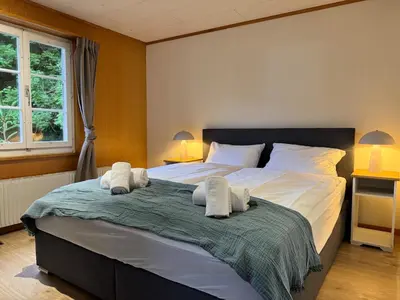 Ein Bett oder Betten in einem Zimmer der Unterkunft River 3 - Kissed Retreat with Iconic Jungfraujoch View