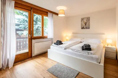 Ein Bett oder Betten in einem Zimmer der Unterkunft Mountain Home with stunning view - by Inspiring Places Zermatt