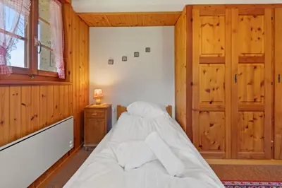 Ein Bett oder Betten in einem Zimmer der Unterkunft Sauna, nature & parking privé - Vercorin, 10 pers