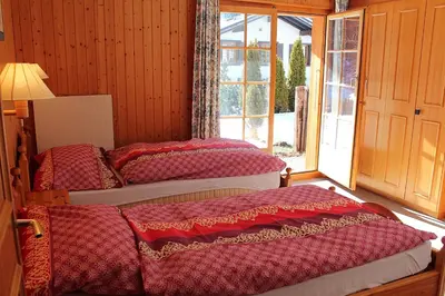 Ein Bett oder Betten in einem Zimmer der Unterkunft Bel Alp 2 Appartement avec jardin Evolene