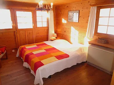 Ein Bett oder Betten in einem Zimmer der Unterkunft Chalet Le Recoulet 8 personnes - Evolene