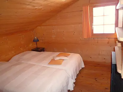 Ein Bett oder Betten in einem Zimmer der Unterkunft Chalet Le Recoulet 4 personnes - Evolene