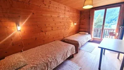 Ein Bett oder Betten in einem Zimmer der Unterkunft Beau Sejour 3- Appartement 6 personnes- Evolene