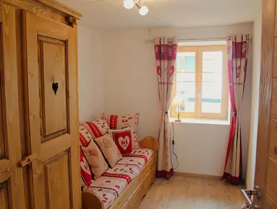 Ein Bett oder Betten in einem Zimmer der Unterkunft Bon Repos - Cosy avec terrasse Evolene