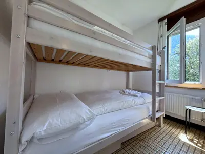Ein Bett oder Betten in einem Zimmer der Unterkunft Royal 32, Untere Maressenstrasse 12