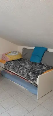 Ein Bett oder Betten in einem Zimmer der Unterkunft Studio Vissoie