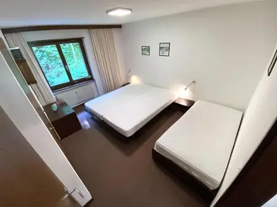 Ein Bett oder Betten in einem Zimmer der Unterkunft Lärchenwald 1803