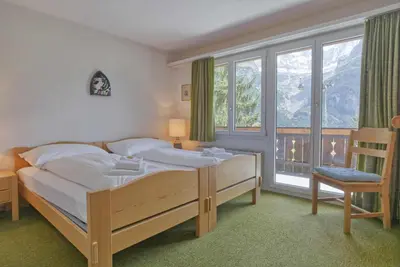 Ein Bett oder Betten in einem Zimmer der Unterkunft Apartment Bodmisunne 4,5 - GRIWA RENT AG