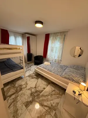 Ein Bett oder Betten in einem Zimmer der Unterkunft swisscheapholiday apartment