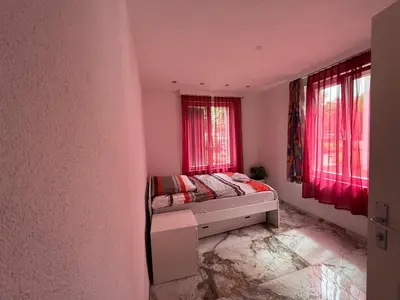 Ein Bett oder Betten in einem Zimmer der Unterkunft swisscheapholiday apartment